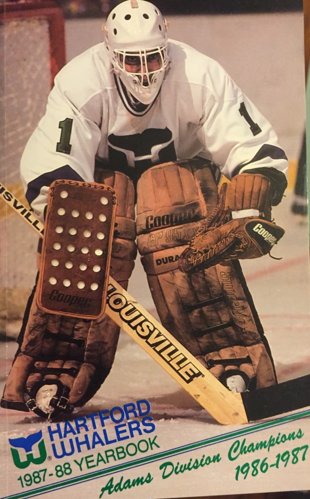 Mike Liut on the cover of the 1987-88 Hartford Whalers media guide and yearbook
